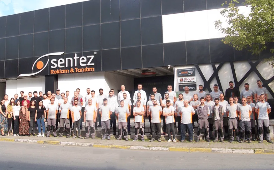The Sentez Reklam team in front of the factory