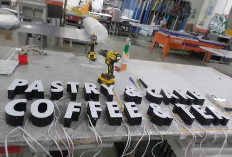 Illuminated channel letters in production