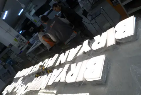 Illuminated channel letters in production