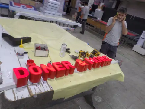 Illuminated channel letters in production