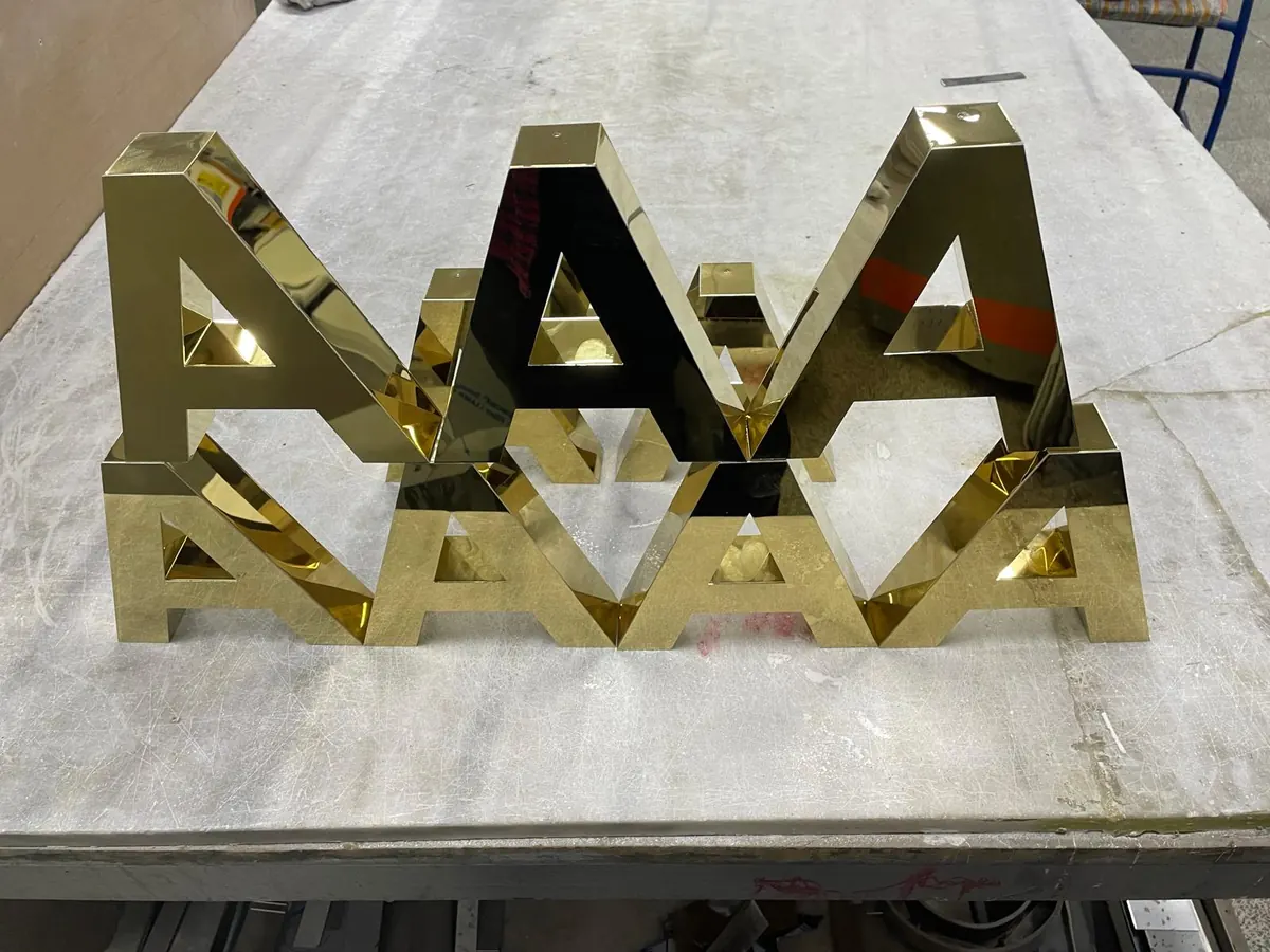 Gold mirror stainless steel letters in the workshop